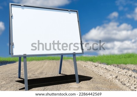 Street sign on dirt road. Place to warn about construction of track. Mock up on street rack. Copy space on white. Portable billboard on rural road. Billboard for message from road service. 