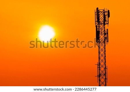 5G Cell Site Digital Cellular Telecommunication Tower Network Antenna on clear sunset orange sky background. Royalty-Free Stock Photo #2286445277
