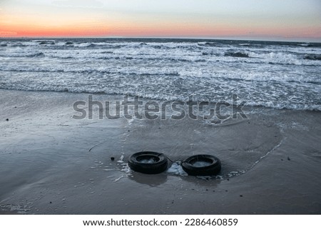 Tires in the sand at the beach 