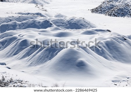 Pristine untouched snow on rolling hills Royalty-Free Stock Photo #2286469425