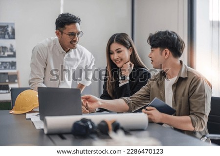 Civil engineer teams meeting working together wear worker helmets hardhat on construction site in modern city. Foreman industry project manager engineer teamwork. Asian industry professional team. Royalty-Free Stock Photo #2286470123