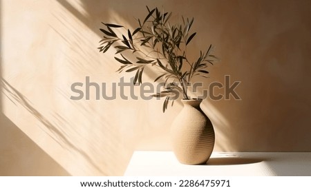 Modern summer minimal of olive tree branch in sunlight with long shadows on beige wall background, copy space interior lifestyle Mediterranean scene Royalty-Free Stock Photo #2286475971