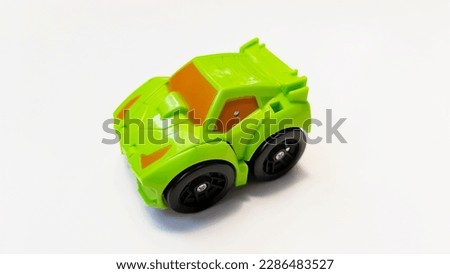 Small toy car green for boys isolated on white background