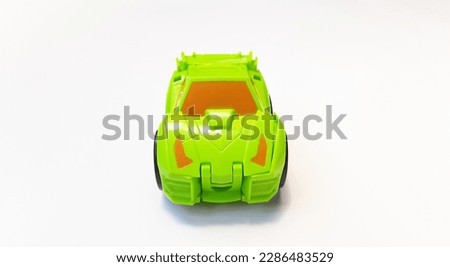 Small toy car green for boys isolated on white background