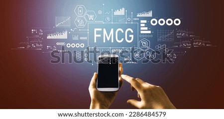 FMCG - Fast Moving Consumer Goods theme with hand pressing a button on a technology screen Royalty-Free Stock Photo #2286484579
