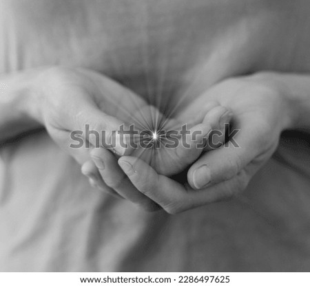 praying to god with hands together on grey black background stock image stock photo	
