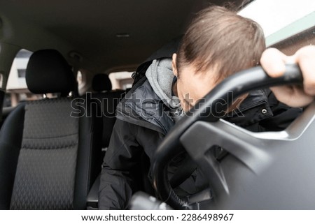 Man driving car despair after car accident Royalty-Free Stock Photo #2286498967