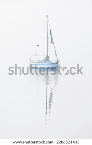 Sailboat In Fog Navarre Florida.
A monohull sailboat is a traditionally shaped vessel with a single hull. The vast majority of consumer sailboats are monohulls.  Royalty-Free Stock Photo #2286521433