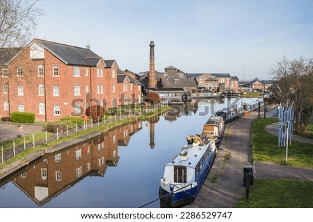 Looking up the still water on the Ellesmere Canal towards Ellesmere Port seen in April 2023. Royalty-Free Stock Photo #2286529747