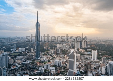 Kuala Lumpur City view with Merdeka Tower view at sunset time. Royalty-Free Stock Photo #2286532507