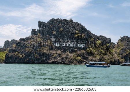 Kilim Geoforest park view with boats from Langkawi Island. Royalty-Free Stock Photo #2286532603