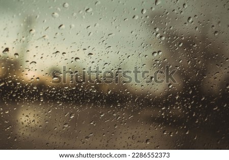 Drizzle on the windshield in the evening