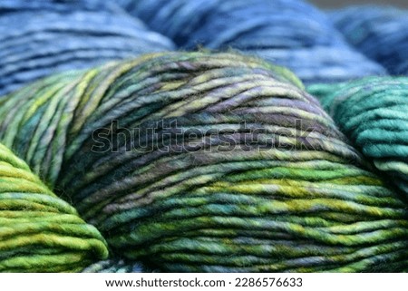 Hand dyed green, blue and purple merino yarn Royalty-Free Stock Photo #2286576633
