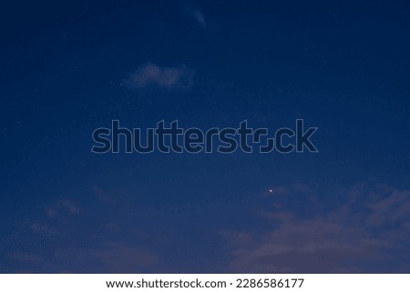 Venus and Pleiades in the night sky.