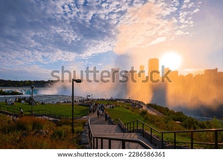 Terrapin Point in Niagara Falls, New York, USA, with sunset view over Niagara River and Cityscape of Niagara Falls, Ontario, Canada Royalty-Free Stock Photo #2286586361