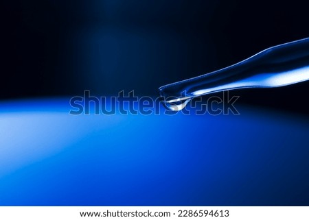 Macro science background,macro science experiment background,Laboratory research, dropping liquid to test tube. Test tube containing chemical liquid in laboratory, lab chemistry or science research an