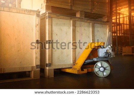 Wooden Crates with Hand Pallet Truck. Storage Warehouse Supply Chain. Shipping Cargo Supplies Distribution Warehouse Logistics.	
