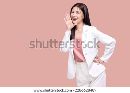 Beauty Asian woman with open mouths raising hands shouting good news isolated on pink background. Royalty-Free Stock Photo #2286628489