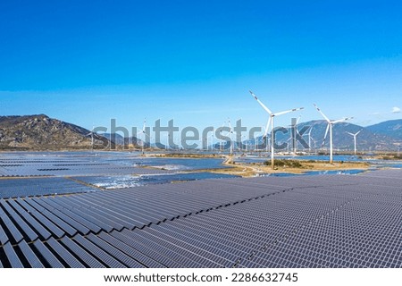 A renewable energy complex including wind power and solar panels in Ninh Thuan. This is a great combination technique to save land and generate as much renewable energy as possible Royalty-Free Stock Photo #2286632745