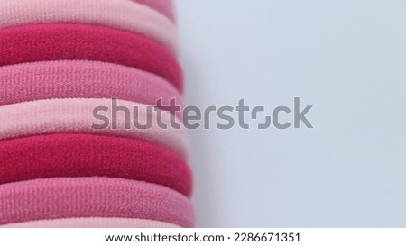 red pink white hairbands rubber band object focus isolated