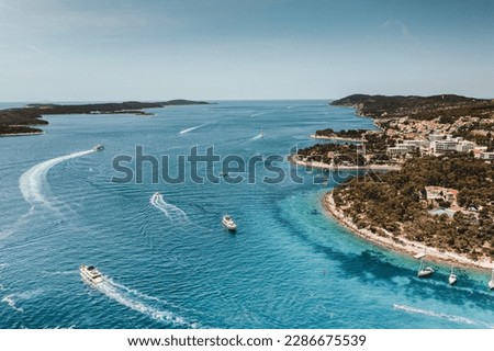 Enjoy the stunning turquoise water bays and luxurious yachts of the Paklinski Islands in Hvar, Croatia from above with this aerial view. Royalty-Free Stock Photo #2286675539