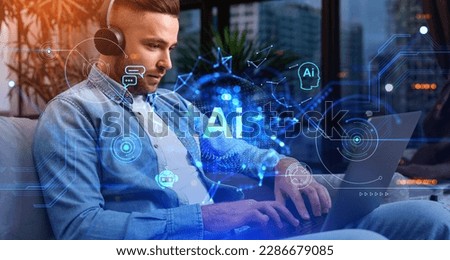 Businessman typing on laptop with headphones, AI hologram with chatbot and online communication, tech lines and connection. Concept of work process and virtual assistant Royalty-Free Stock Photo #2286679085