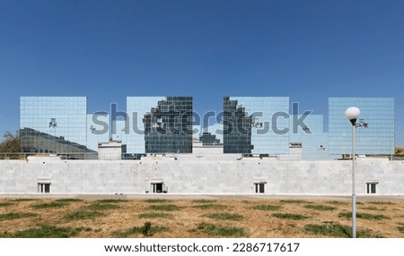 Solar furnace ( Sun Institute), second largest in world. View of giant sun concentrator on mountain and heliostats Royalty-Free Stock Photo #2286717617