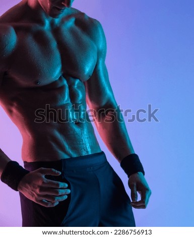 Close-up body photo. Man athlete isolated on color background. Gym full body workout. Muscular man athlete in fitness gym have havy workout. Sports trainer on trainging. Fitness motivation.