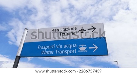 Italian and English airport and water transport signs in Marco Polo Airport in Venice Royalty-Free Stock Photo #2286757439