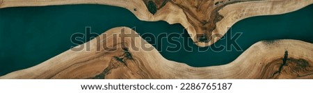 Green or blue epoxy resin panel with walnut, texture for design, source, template Royalty-Free Stock Photo #2286765187