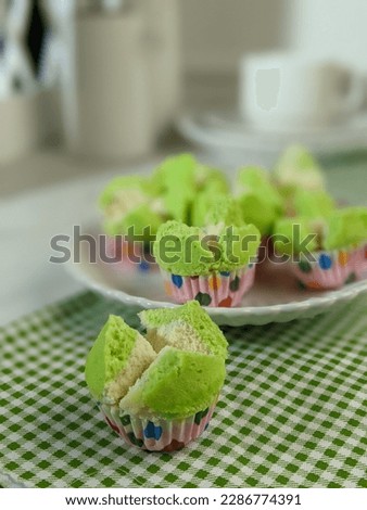 colorful apam mekar or steamed puff for snacks popular in Malaysia and Indonesia. Bright background