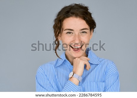 Happy young smiling confident professional business woman, happy pretty lady looking at camera, isolated at grey background, advertising commercial promo offer, close up headshot portrait. Royalty-Free Stock Photo #2286784595