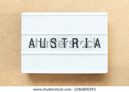 Lightbox with word austria on wood background