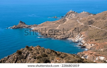 nice senior woman cycling with her electric mountain bike in the volcanic nature park of Cabo de Gata, Costa del Sol, Andalucia Royalty-Free Stock Photo #2286801819