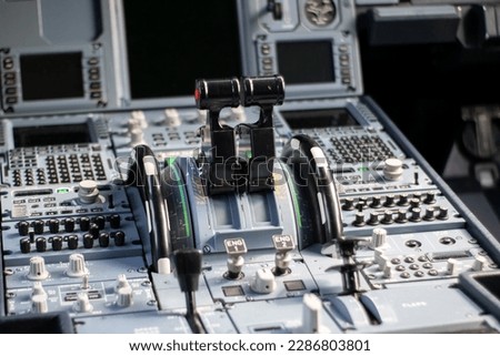 Close up of Airbus throttles levers , airplane flight deck Royalty-Free Stock Photo #2286803801