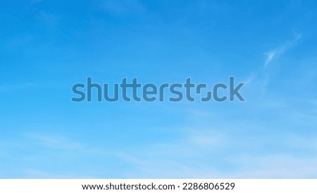 White cirrus and stratus clouds in a blue daytime sky, timelapse Royalty-Free Stock Photo #2286806529