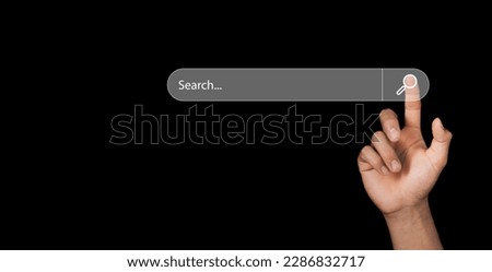 Human hand touching search bar for Search Engine Optimization or SEO to search information or information by internet connection, internet, network, database,information system.
