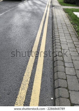 Double yellow line on the road means no stopping at any time in the UK