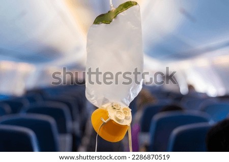 oxygen mask drop from the ceiling compartment on airplane	
 Royalty-Free Stock Photo #2286870519