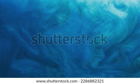 Glitter fluid. Ink water. Particles texture. Paint swirl. Blue color shimmering glowing sparkling smoke cloud abstract art background with free space.