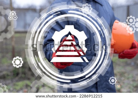 Industrial concept of organization chart. Structure of manufacturing plant. Hierarhy. Industrial worker or engineer clicks a virtual icon of pyramid with gear.
