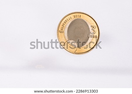 Used commemorative anniversary bimetal 3 euro Slovenia coin 2012. Worn out special three euro coin from Slovenia.