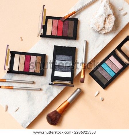 Multi-colored palettes for eye shadows, makeup and female beauty. Photo for advertising cosmetics and makeup Royalty-Free Stock Photo #2286925353