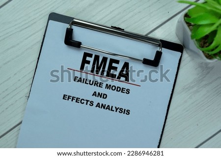 Concept of FMEA - Failure Modes and Effects Analysis write on paperwork isolated on Wooden Table. Royalty-Free Stock Photo #2286946281