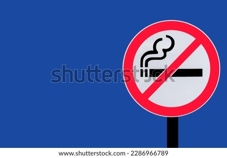 no smoking in public places sign on black iron pillar In nature, public places, fines, high detail photos Royalty-Free Stock Photo #2286966789