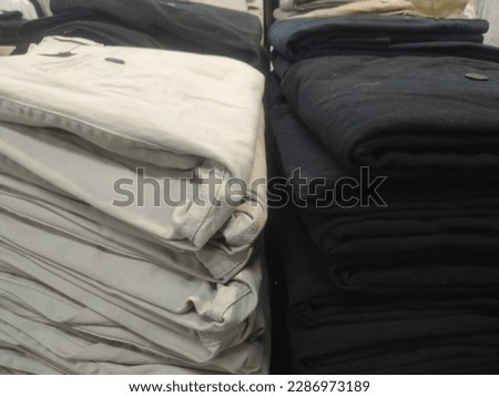pile of cloth pants in the supermarket