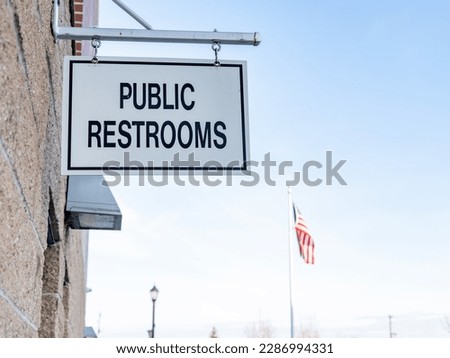 Public restrooms sign in a local park 