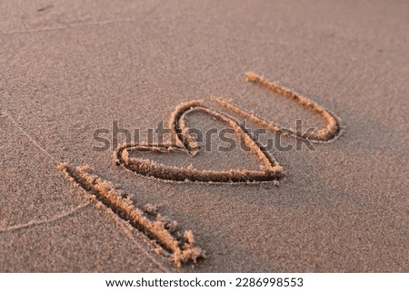 Writing and drawings on the beach
