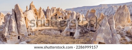 Beautiful stunning view of the mountains of Cappadocia and cave houses. Turkey BANNER, LONG FORMAT