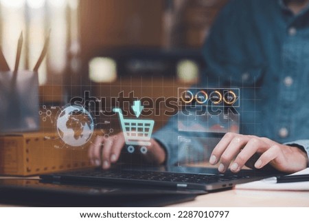 Startup or small business entrepreneur,Check sales and check business growth reports,order management in online stores,shopping on the internet,Selling online on Internet,SME,shipping boxes,e-commerce Royalty-Free Stock Photo #2287010797